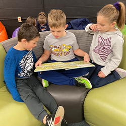 Three students reading together